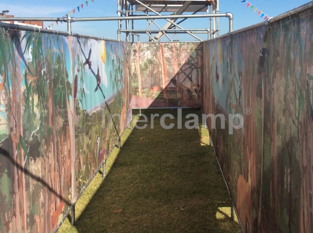 Colourful maze built with Interclamp tube clamp fittings for Australia Day celebrations, offering a fun and safe activity for attendees of all ages.